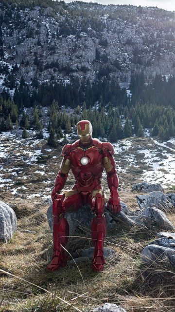 Iron Man Sitting on Stone Mountains iPhone Wallpaper