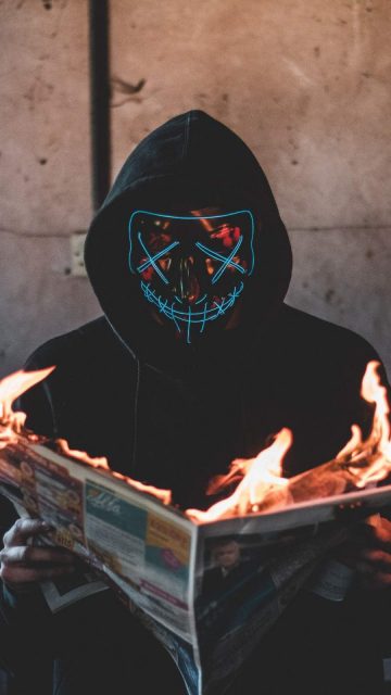 Mask Guy Reading Burning News Paper iPhone Wallpaper