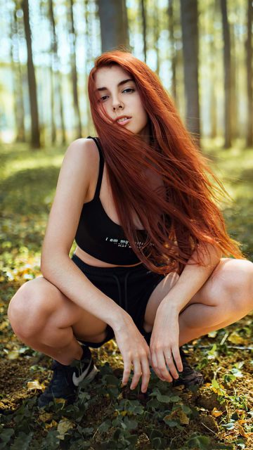 Redhead Girl in Forest