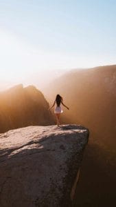 Girl on Rock iPhone Wallpaper