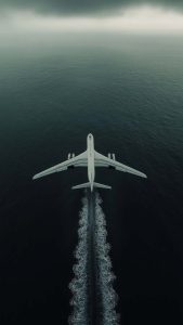 Plane Flying Over Sea iPhone Wallpaper