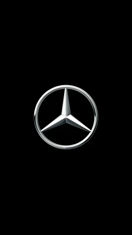 Iconic silver Mercedes-Benz three-pointed star logo with a metallic chrome finish on a black background.