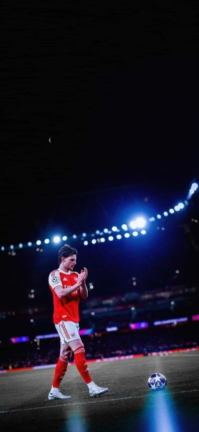 declan rice clapping stadium night lights iphone wallpaper scaled