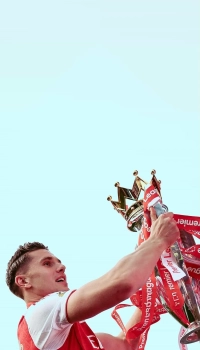 leandro-trossard-lifting-premier-league-trophy-sky-background leandro trossard lifting premier league trophy sky background