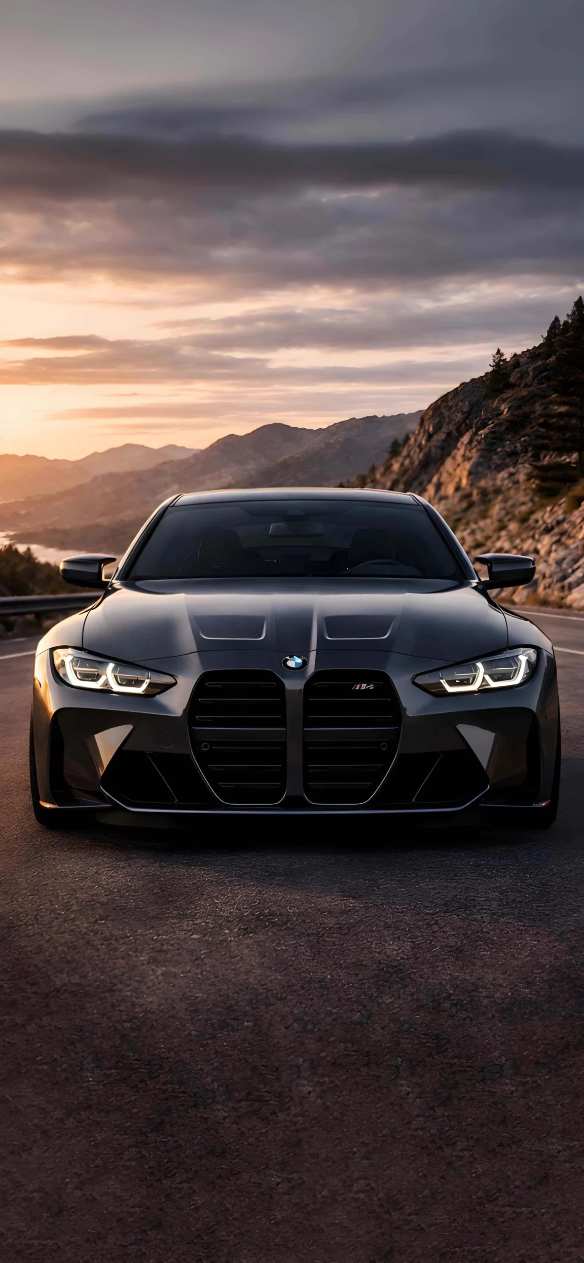 BMW M4 iPhone Wallpapers: High-Resolution 4K Backgrounds 10 dark-grey-bmw-m4-g82-sunset-mountain-road-iphone-wallpaper
