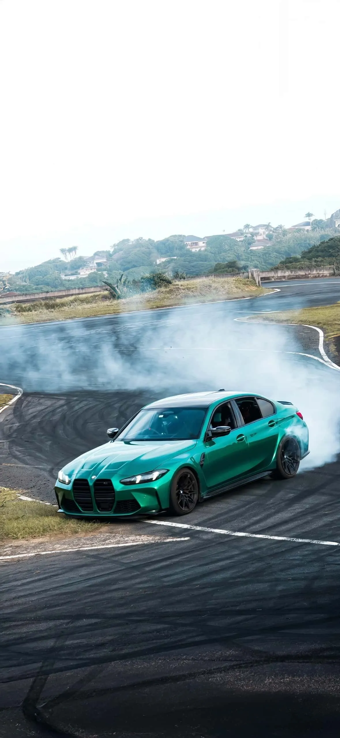 BMW M4 iPhone Wallpapers: High-Resolution 4K Backgrounds 12 isle-of-man-green-bmw-m3-g80-drifting-track-iphone-wallpaper