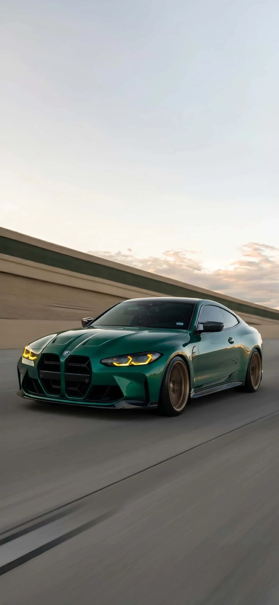 BMW M4 iPhone Wallpapers: High-Resolution 4K Backgrounds 13 isle-of-man-green-bmw-m4-coupe-highway-motion-iphone-wallpaper