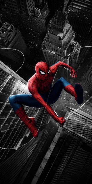 Spider-Man in his iconic red and blue suit crouching against a dark black-and-white skyscraper backdrop in New York City.