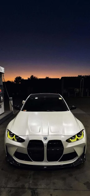 30 Best HD BMW iPhone Wallpapers (4K M Series & Classic) 18 bmw-m4-yellow-headlights-gas-station-iphone-wallpaper
