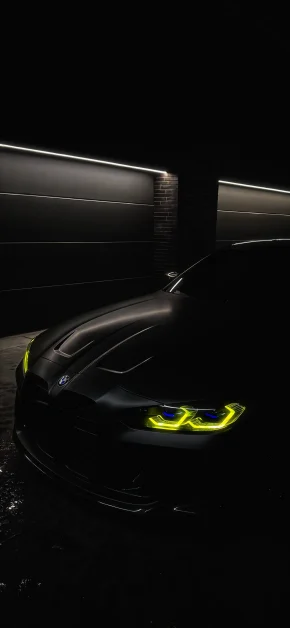 30 Best HD BMW iPhone Wallpapers (4K M Series & Classic) 26 bmw-yellow-headlights-dark-garage-iphone-wallpaper